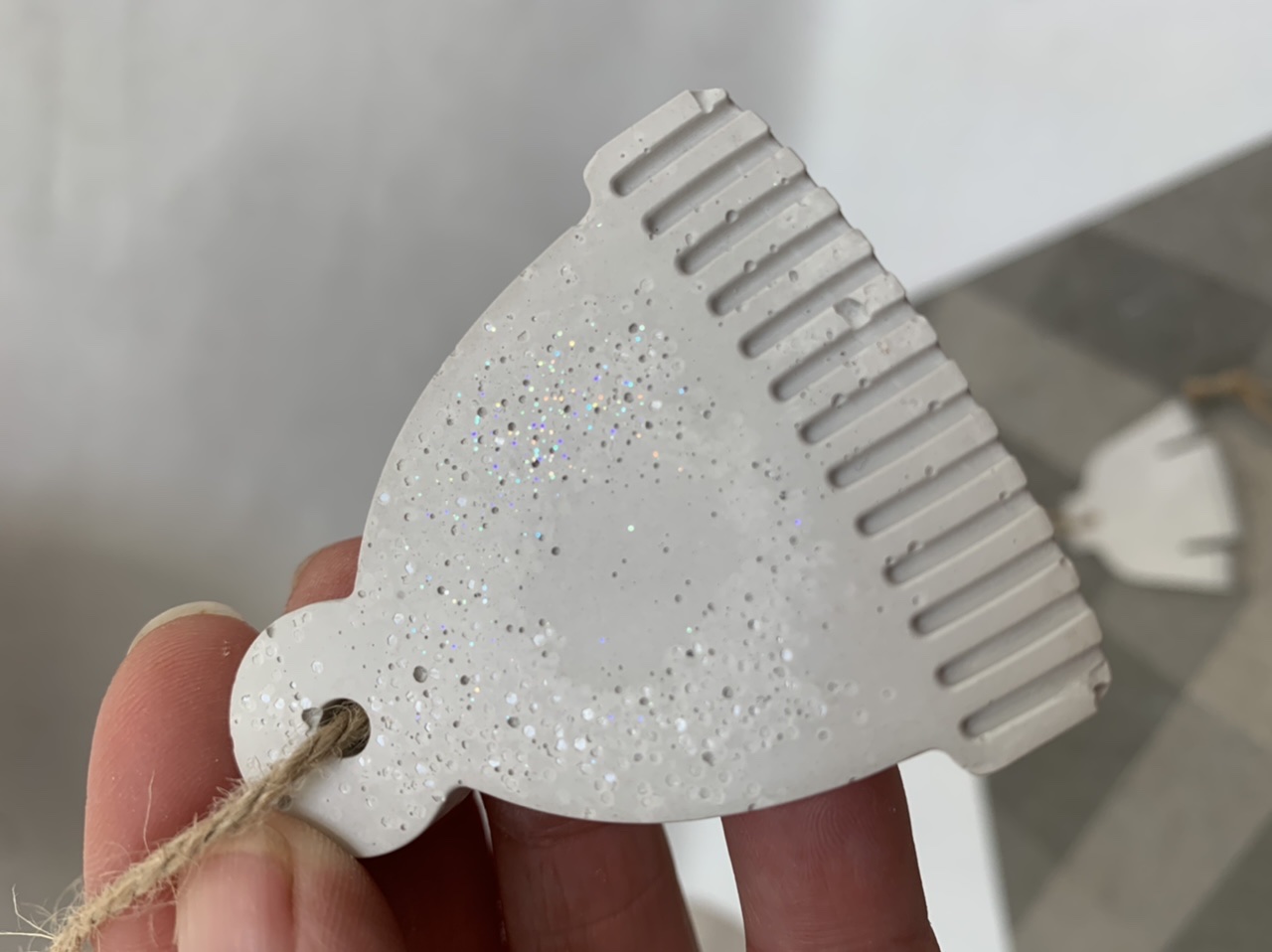 FB0A898C-AAA7-4A9D-9154-CD5B3F46A59E Sparkly concrete ornament